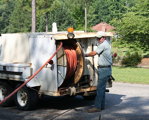 construction worker fixing a broken pipeline.