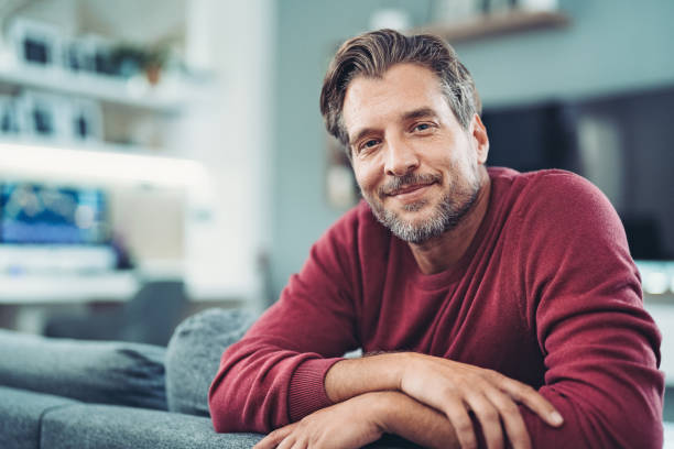 County Page portrait of a smiling man at home